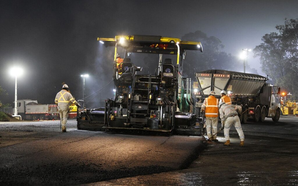 Construction crews and equipment on the Eastern Freeway in Melbourne during North East Link Project flyover lane installation works