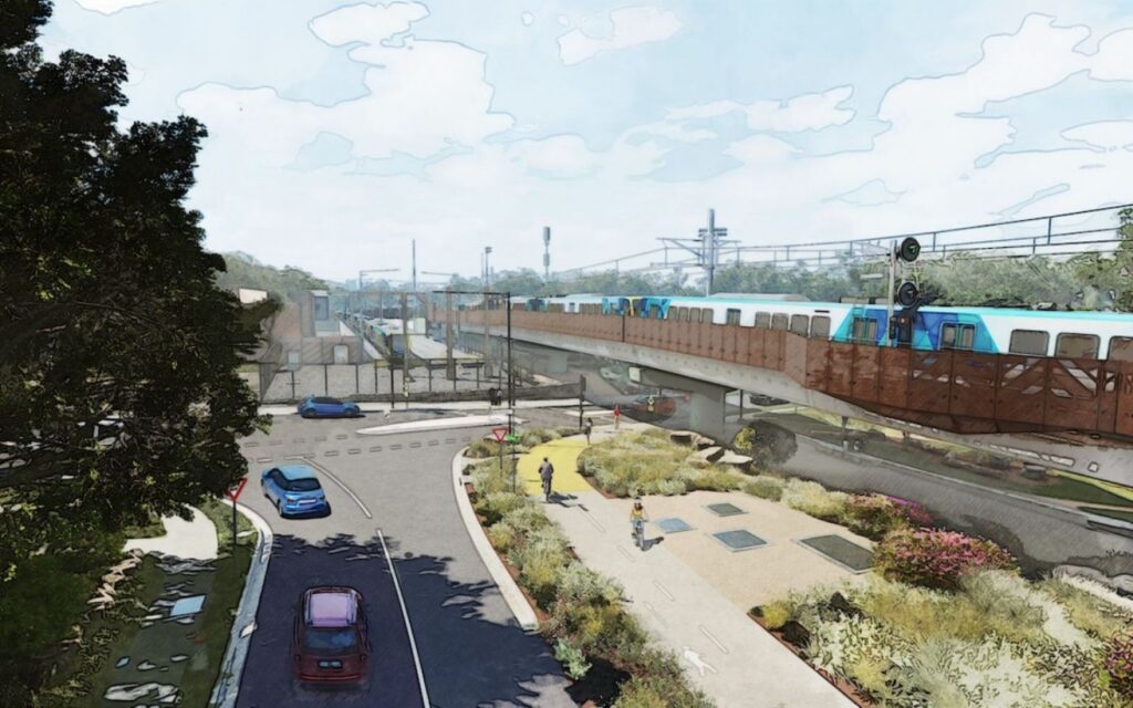 Concept design for the new Macleod rail bridge, part of a Melbourne train station precinct upgrade on the Hurstbridge Line, showing a train crossing above Ruthven Street with landscaped green space and free-flowing traffic below
