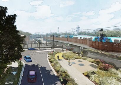 Concept design for the new Macleod rail bridge, part of a Melbourne train station precinct upgrade on the Hurstbridge Line, showing a train crossing above Ruthven Street with landscaped green space and free-flowing traffic below