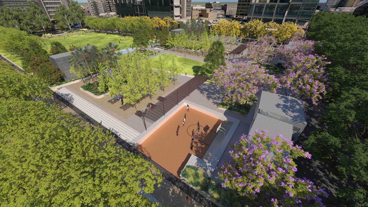Render of a multi-purpose sports court at University Square surrounded by jacaranda trees and new landscaping, part of the Metro Tunnel Parkville precinct redevelopment.