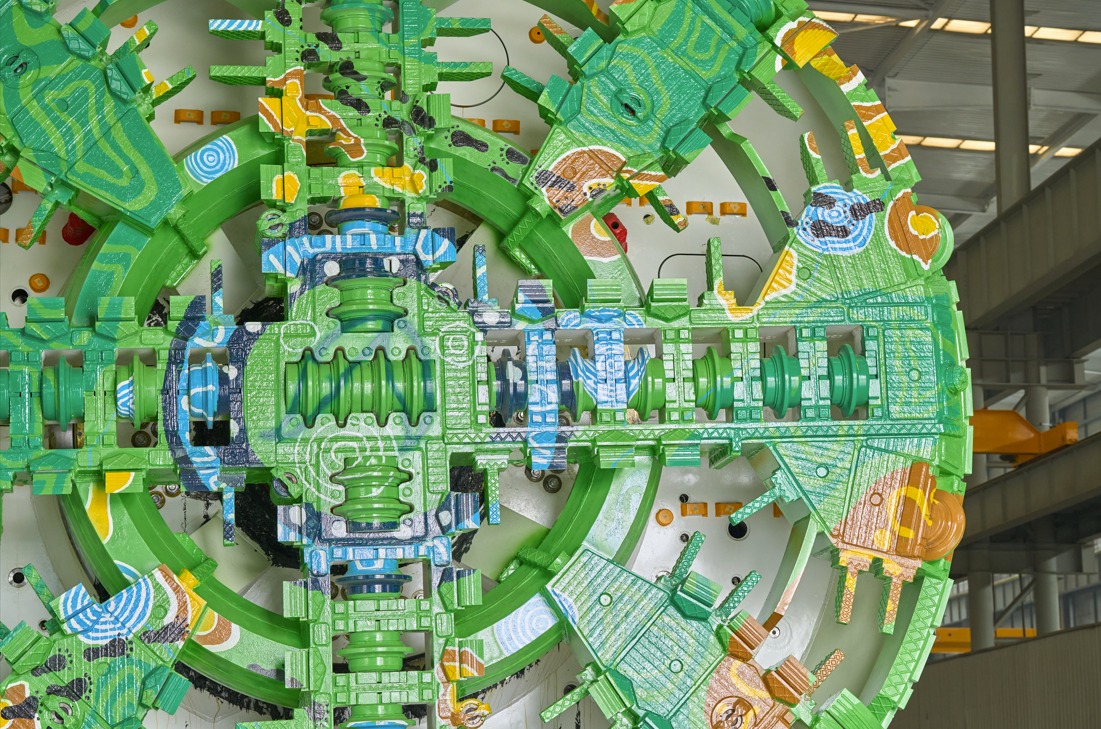 Close-up of Wurundjeri and Dja Dja Wurrung artist Hayden Roberts' artwork painted across the cutterhead of a Suburban Rail Loop tunnel boring machine