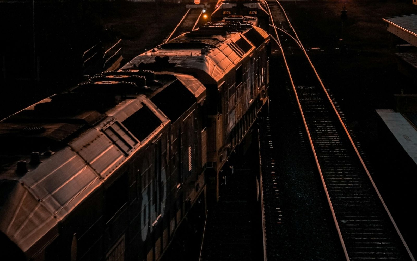 A train moves along rail tracks at dusk as ARTC prepares to shut the sydney to melbourne train corridor for 96 hours of upgrade works