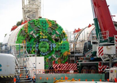 Suburban Rail Loop tunnel boring machine with Aboriginal artwork on its cutterhead being assembled at the Burwood launch site in Melbourne's east