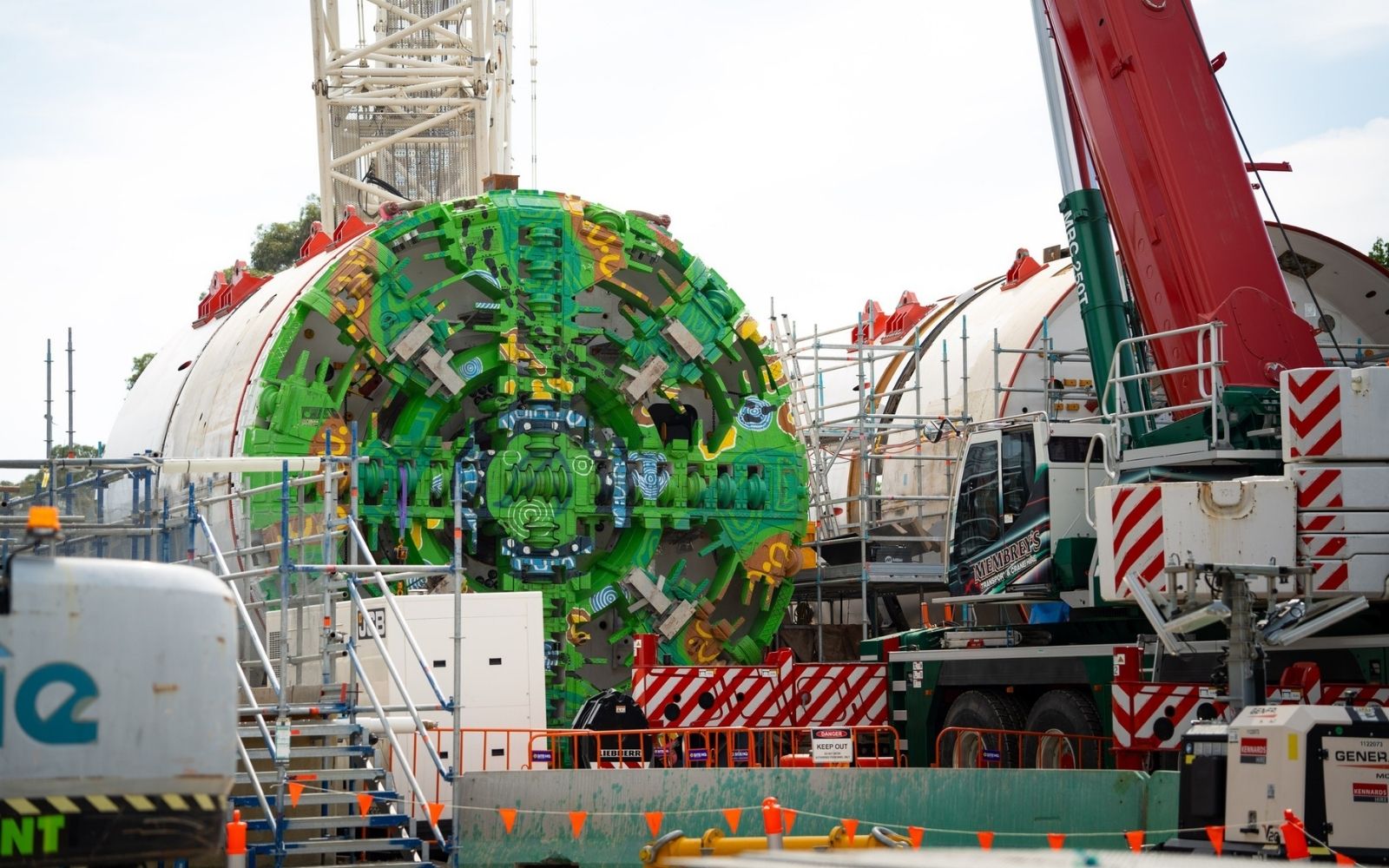 Suburban Rail Loop tunnel boring machine with Aboriginal artwork on its cutterhead being assembled at the Burwood launch site in Melbourne's east