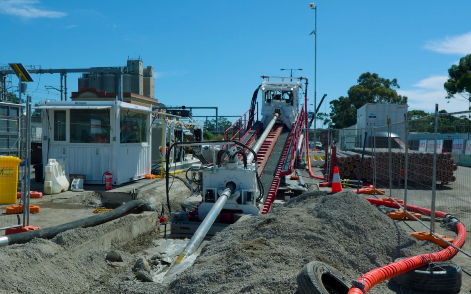 Pipes laid out for the new jet fuel pipeline between the new Melbourne train stations.