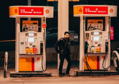 A motorist fills up her car at a petrol station as Victorian fuel prices remain elevated in 2026