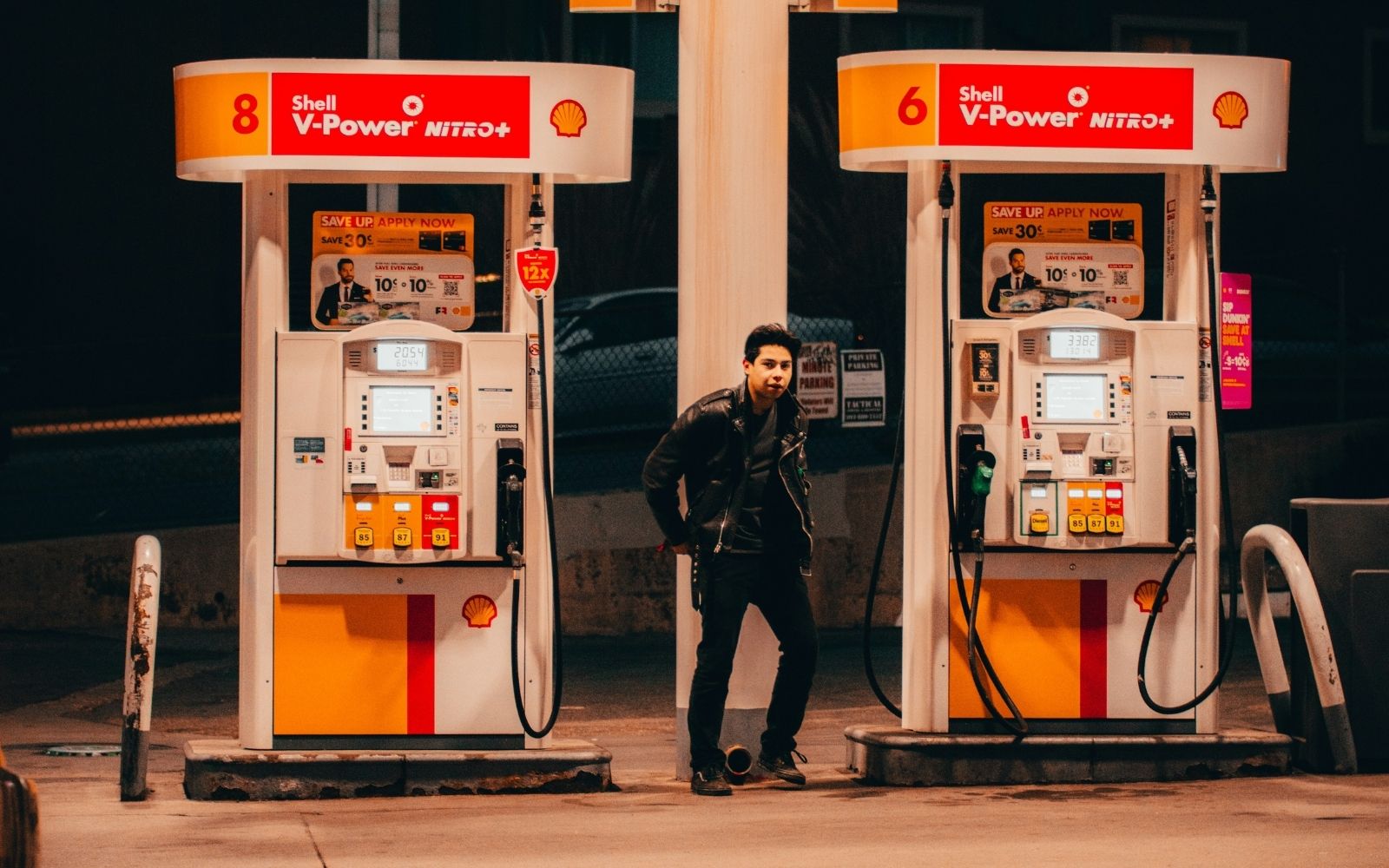 A motorist fills up her car at a petrol station as Victorian fuel prices remain elevated in 2026