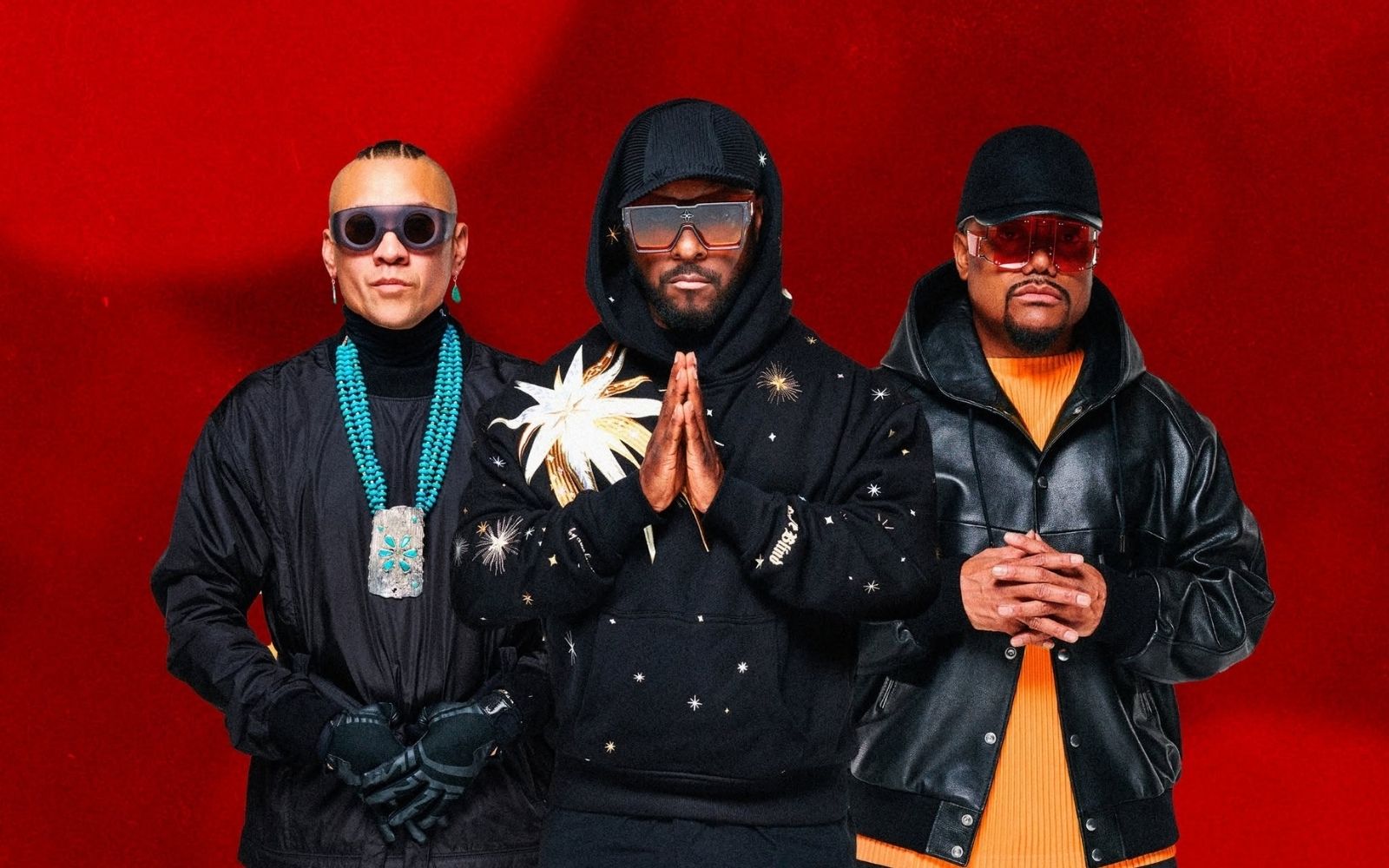 Black Eyed Peas in black against a red backdrop, leading the BTV lineup at Beyond The Valley 2026.