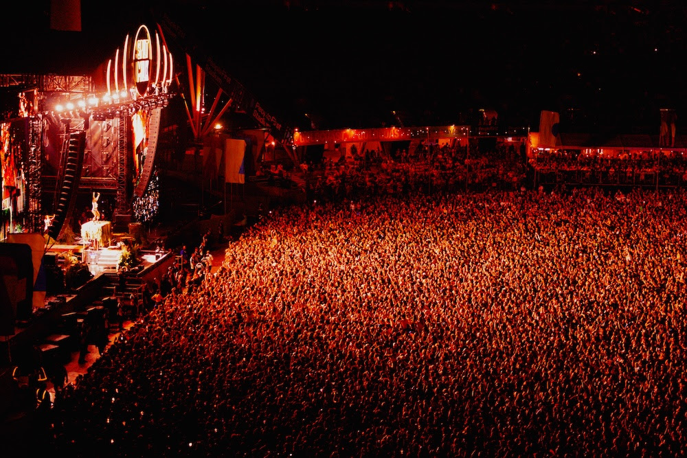 Packed crowd in front of a main stage at night, ahead of the 2026 Spilt Milk lineup announcement. 