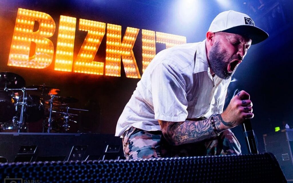 Good Things lineup headliner Limp Bizkit's Fred Durst screaming into a mic on a black background.