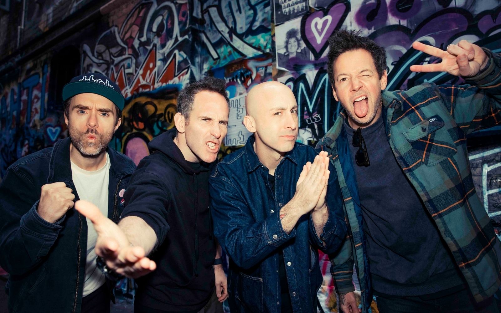 Simple Plan also lead the Good Things lineup in 2026. A picture of the band members against a wall.